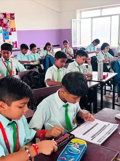 A snapshot of a typical day at my academy. Here, students are deeply focused, using their abacus tools to solve problems. I ensure every child gets the space and guidance they need to master their calculation skills.