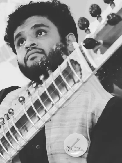 Looking up during a performance, perhaps lost in thought or listening to the resonance of a note. These are the unscripted moments of live music.