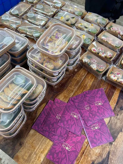 A behind the scenes look at my kitchen during the busy festive season. This image shows dozens of meal boxes packed and ready for delivery for Rakhi and Ganpati, highlighting our capacity for large orders.