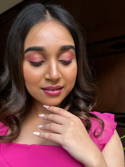 A close-up showing the detail of the eye makeup and the clean, manicured nails. A professional look is about the entire presentation, a concept I instill in my students.