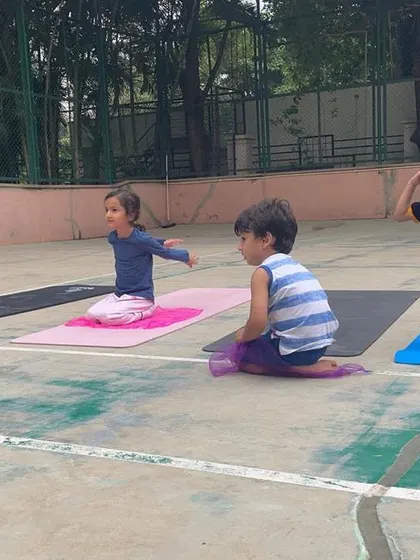 A look at our outdoor program, where we bring "Serious Fun" right to your apartment's doorstep. These images show kids enjoying gymnastics and yoga on mats in both indoor and outdoor community spaces.