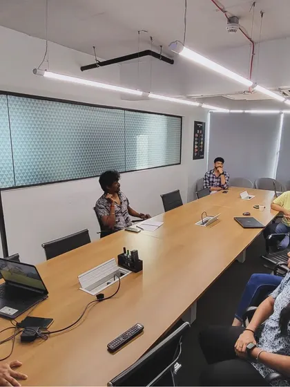 An alternate angle of the boardroom discussion, showing the engaged and thoughtful participants.