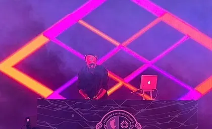 Rocking a corporate sales conference. The stage design with geometric LED patterns created a cool, futuristic vibe for the event.