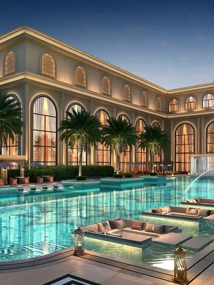 The main pool at Casagrand Sun City is a centerpiece of luxury, featuring in-water lounge seating and grand architectural backdrops for resort-style living.