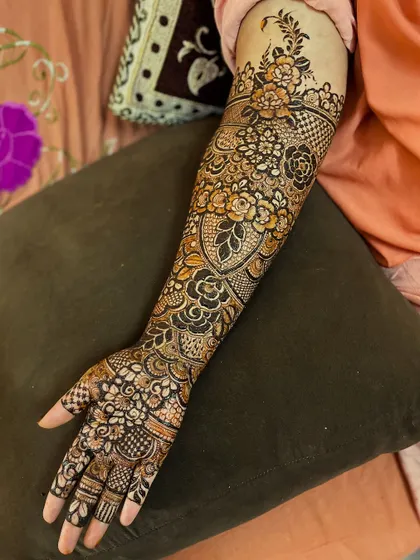 This design features a heart-shaped gap in the center, surrounded by my signature floral work. It's a unique twist on a classic bridal look.
