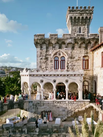A daytime view of the historic castle venue in Lisbon, Portugal. The architecture and setting provide a stunning, fairy tale backdrop for a wedding ceremony.