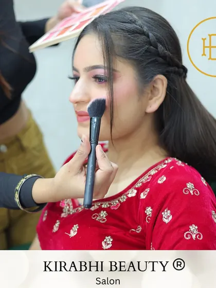 Here you can see me applying blush to a bride. I use high-end products like MAC and Huda Beauty to build color gently for a natural, long-lasting flush.