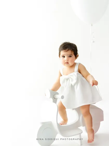 A quiet, direct gaze into the camera. Even in a playful setup, I look for these serene moments that reveal a glimpse into their little soul.