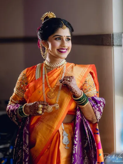 The bride looks joyfully towards the light, her happiness palpable in this beautifully lit portrait.