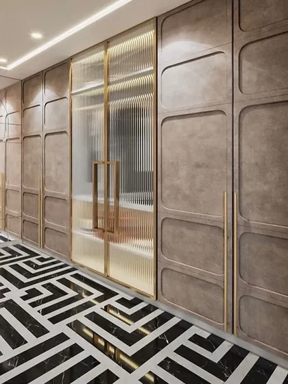 A walk-in closet with a mix of open and closed storage. The design features fluted glass doors, textured panels, and a bold geometric floor.