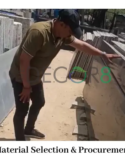 The right materials are the backbone of a lasting design. Here, you can see a member of our team carefully inspecting stone slabs. We are meticulous about material selection and procurement to ensure quality and durability in all our projects.