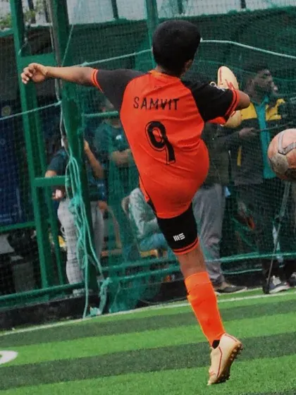 A dynamic action shot of a U-9 player striking the ball mid-air. I train players to be creative and technically skilled.