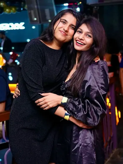 Friends enjoying the music and the atmosphere. It's all about good times and great music.