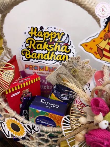 This fun and quirky Rakhi hamper is packed in a handmade jute basket. It's filled with chocolates and snacks, perfect for celebrating your unbreakable bond with sweetness and style.