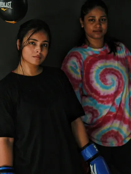 The quiet confidence of a fighter. These women are not here to play, they are here to work.