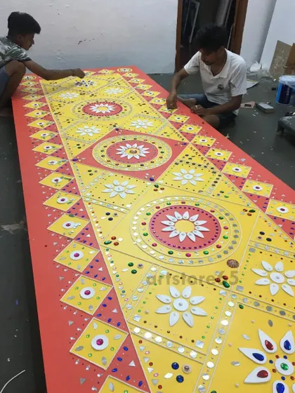 Our team working together to place mirrors on a large, geometric Lippan art panel. These large-scale pieces are a collaborative effort, ensuring quality and consistency across the entire artwork.