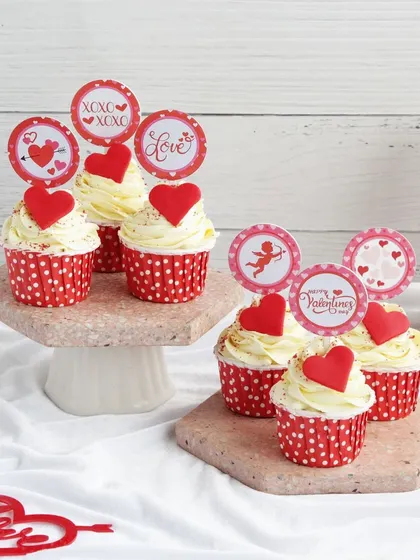 Cupcakes for your cupcake. These vanilla cupcakes with heart toppers and Valentine's themed picks are a sweet and simple way to say "I love you."