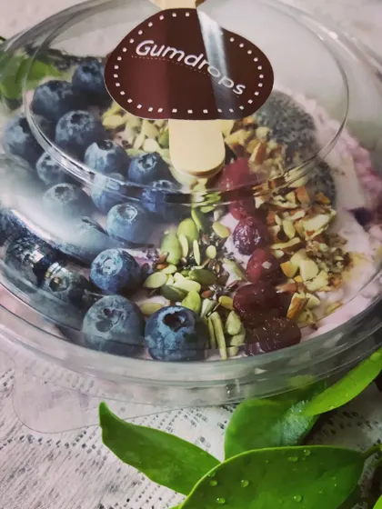 Start your day on a healthy note with our Berry Smoothie Bowl. A thick, creamy smoothie is topped with fresh blueberries, chia seeds, and a mix of nuts and seeds for a nutritious breakfast.