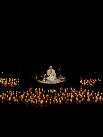 At the heart of every performance is a moment of stillness. Here, surrounded by candles at the Tagore Theatre, I begin with a meditation, creating a space for us to breathe, connect, and find calm together before the music begins.