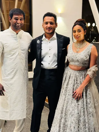 Posing with the happy couple, Dhanush and Soundarya, at their sangeet. It's a privilege to be part of their special day and help them create memories that will last a lifetime.