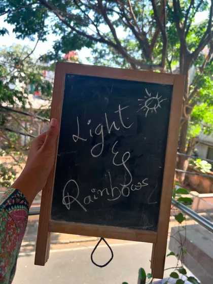 Our chalkboard setting the stage for a session all about the magic of light and rainbows.