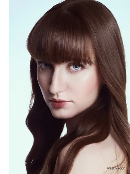 A clean, bright portrait perfect for a hair campaign. The lighting is designed to bring out the shine and texture of the hair, while keeping the skin looking natural and fresh.