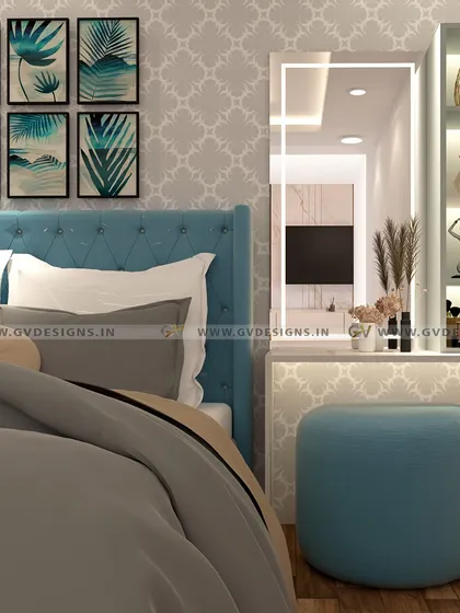 This view highlights the dressing unit, which features tall open shelving with scale lights for displaying decor. A comfortable blue pouf provides seating, tying the dressing area in with the room's overall color scheme.