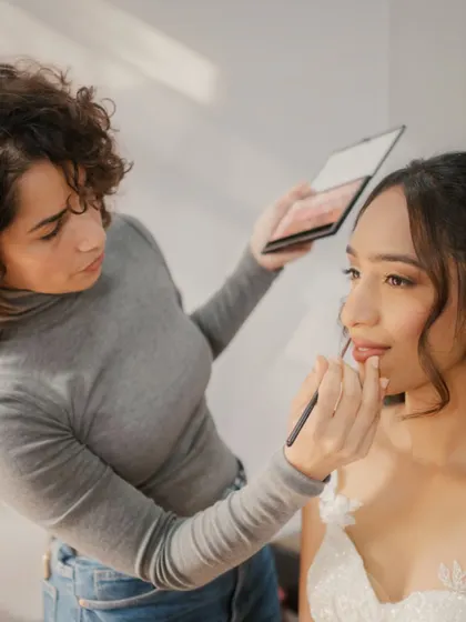 I can't get over the gorgeousness of this look. Here I am applying a custom lip color to complete this elegant, fresh, and effortless bridal style.