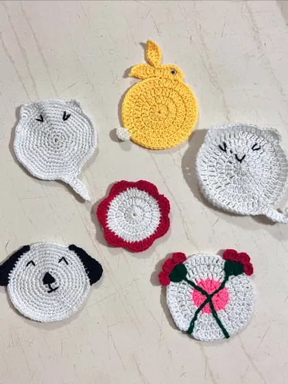 A slightly different angle of the cute, handmade animal tea coasters.