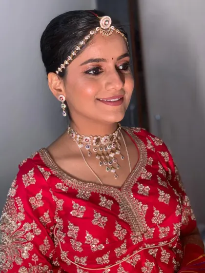 A simple and elegant look for the Pheras ceremony. The makeup is minimal and fresh, perfect for a long day of rituals.