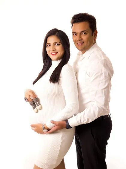 A classic couple's portrait with a modern twist. The simple white and black outfits create a timeless look that is clean, elegant, and full of love.