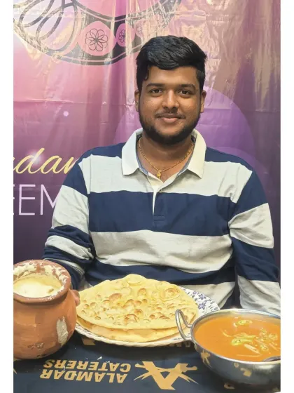 A complete meal featuring our famous Matka Chicken, served in a traditional clay pot, alongside soft parathas and cool raita.