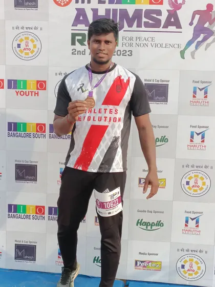 Proudly showing off my medal after the 10km Ahimsa Run. It's not just about the race, but the journey of preparation.