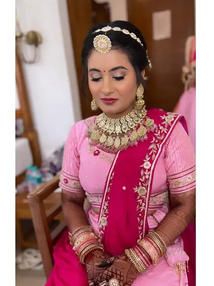 Beauty reflects from the inside out. For this beautiful bride, I created a sparkling eye makeup look and a classic updo, accented with a traditional matha patti for a touch of elegance.