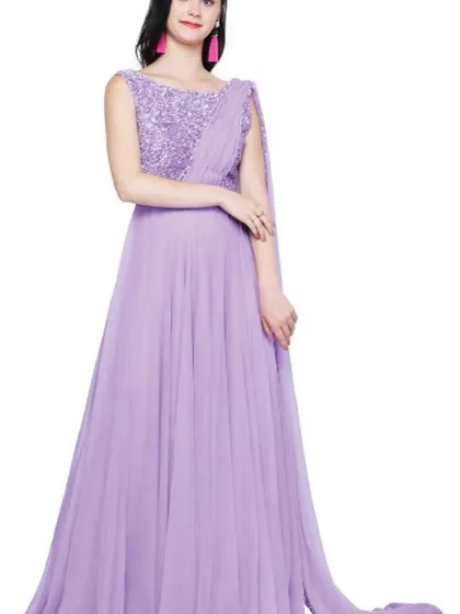 A beautiful lavender gown with a sequined bodice and an attached draped dupatta. This soft, pastel color and flowing silhouette make it a dreamy choice for a reception or evening party.