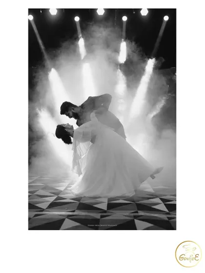 A timeless black and white shot capturing the romance of the first dance. I use dramatic lighting and effects like this fog machine to add that extra touch of magic to your reception or sangeet night.