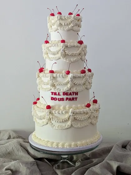 I've always wanted to make a grand, multi-tiered vintage cake. This design, with its intricate buttercream piping and cheeky "Till Death Do Us Part" message, brings a bit of old-school romance and fun to a wedding celebration.