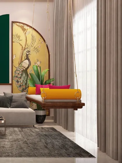 This living room is full of life, with a traditional swing, colorful cushions, and a beautiful peacock mural as a focal point.