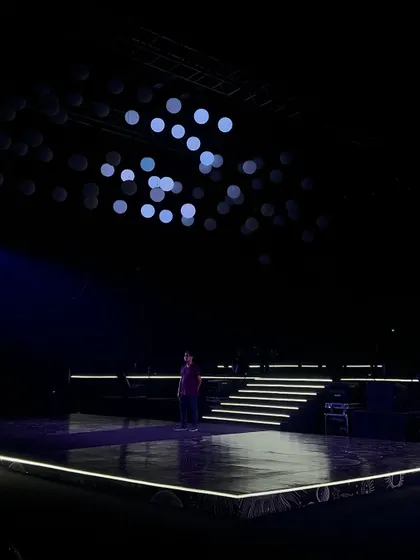 The calm before the storm. The empty stage and kinetic lights, ready for a night of unforgettable performances.