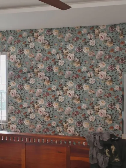 A vintage-style floral wallpaper with a teal background. This dense pattern is perfect for creating a cozy and romantic bedroom.