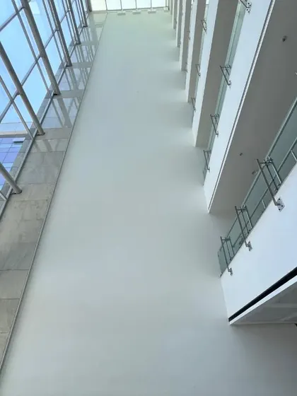 From a blank 100-foot canvas to a completed masterpiece. These images show the before, the design concept, and the final artwork for our Embassy Group project, illustrating the journey of our creation.
