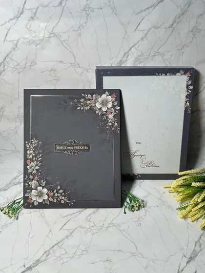 I love the drama of a dark, moody palette. This luxurious invitation suite pairs a sophisticated charcoal background with soft floral illustrations and elegant typography, creating a bold and unforgettable first impression.