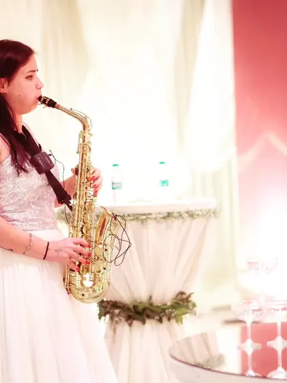We ensure every detail is perfect, including providing live entertainment like this talented saxophonist to create a sophisticated ambiance for the brand event.