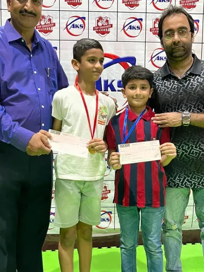 Two of my young champions receiving their prizes. It is very rewarding to see the next generation of players achieving their goals.