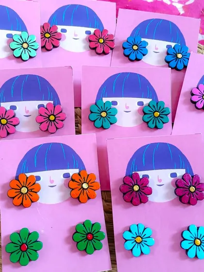 A collection of simple floral studs in a variety of colors. These are perfect, affordable items for everyday wear and make great add-on sales for resellers.