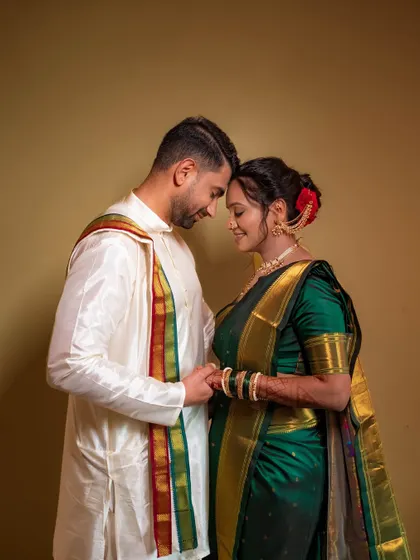 A romantic portrait of the couple, their foreheads touching, capturing the deep connection between them on their wedding day.