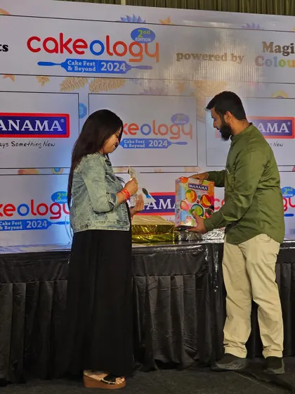 A proud moment receiving my Silver Award at the Cakeology competition. This achievement, judged by global chefs, is a testament to my passion for baking.