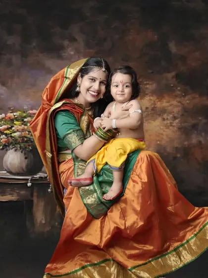 A beautiful portrait of Yashoda and her little Krishna. This culturally rich photo captures the divine bond between a mother and her child.