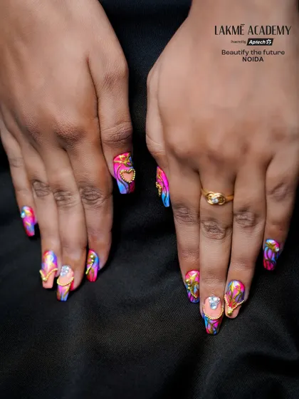 Learn to create vibrant, festival-themed nail art, like this design for Holi. We teach you how to work with bold colours, neon pigments, and 3D embellishments to make every set of nails a celebration.