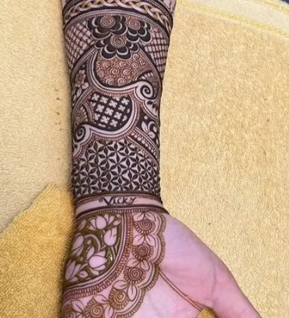 The lower part of the elephant design, showing how the name 'Vicky' is written into the pattern, a personal touch for the client.